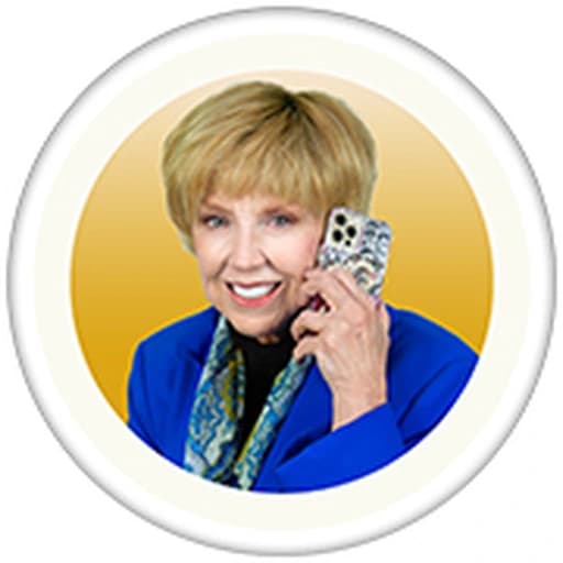 Dr. Jan Duffy — Las Vegas Relocation Specialist Dr. Jan Duffy, REALTOR® — Las Vegas Relocation Services, holding a phone